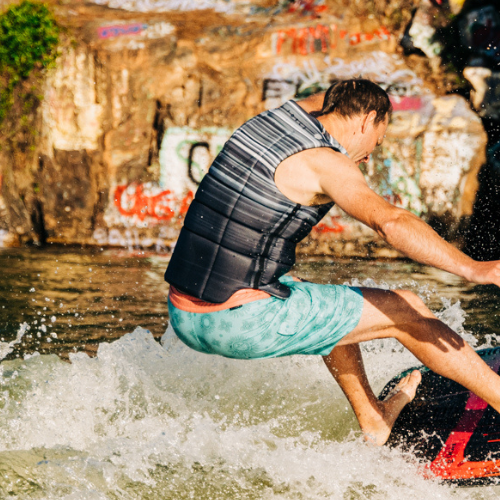 Man riding a Liquid Force Wakesurf Board