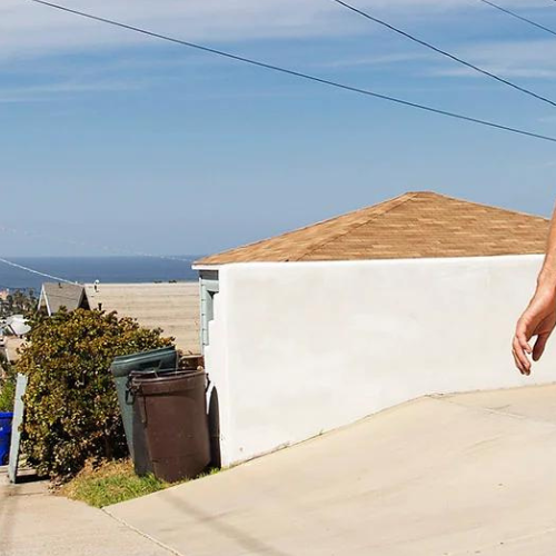 Man riding a surf skateboard from Sector 9