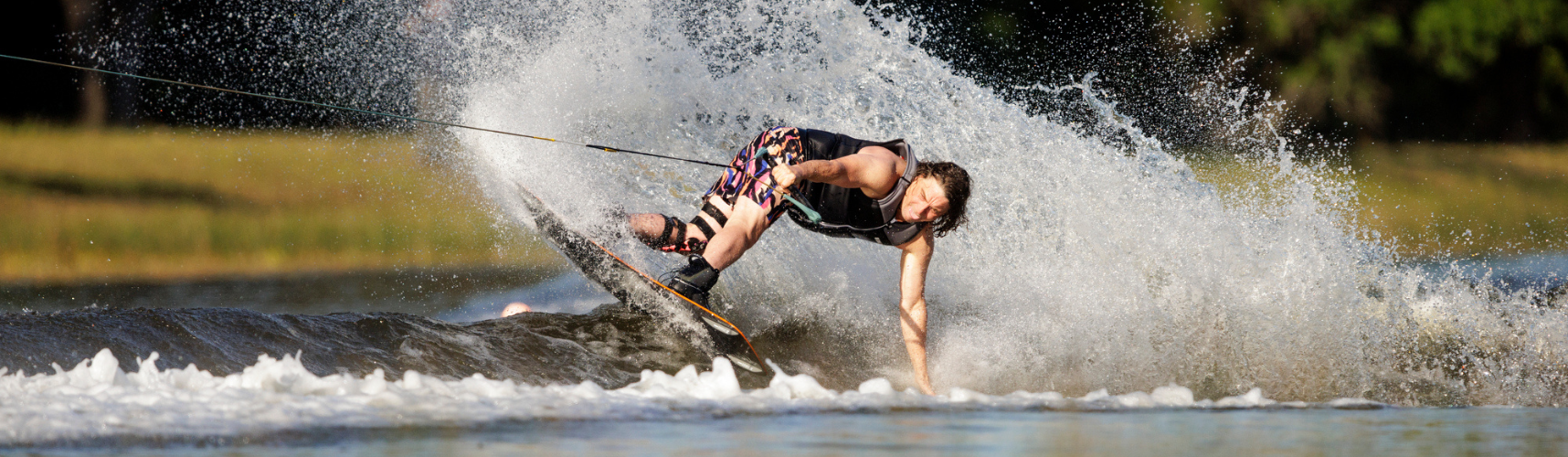 Man riding a Ronix Parks Wakeboard